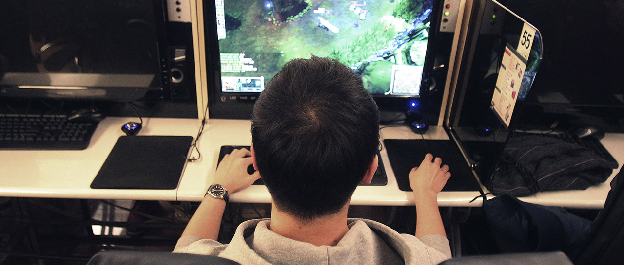 Shin Minchul, a 21-year-old college student, plays online computer games at an Internet cafe in Seoul, South Korea, Wednesday, Dec. 11, 2013. A law under consideration in South Korea's parliament has sparked vociferous debate by grouping popular online games such as "StarCraft" with gambling, drugs and alcohol as an anti-social addiction the government should do more to stamp out.(AP Photo/Ahn Young-joon)